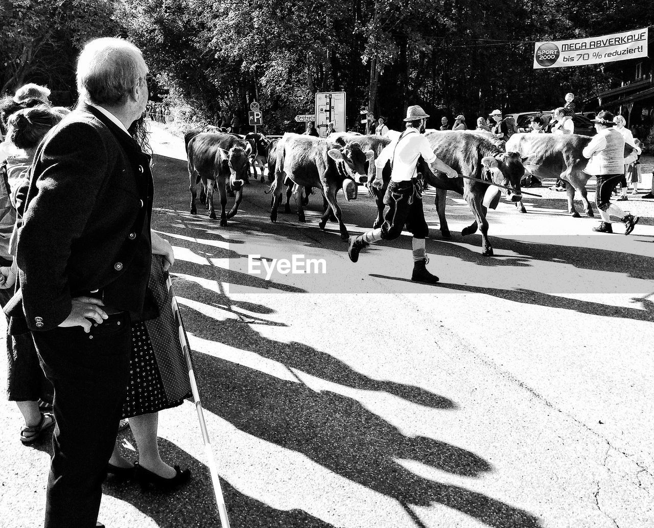 PEOPLE WALKING ON ROAD