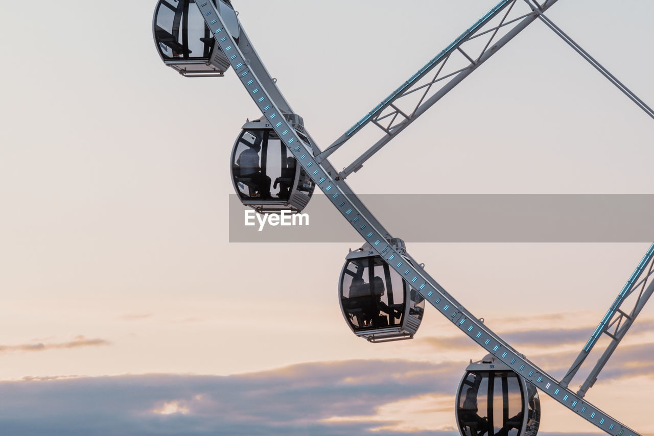 LOW ANGLE VIEW OF CRANE AGAINST SKY