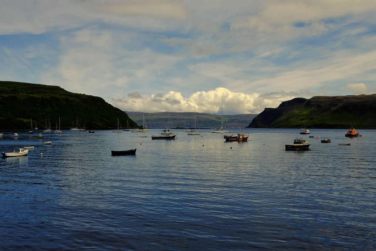 High angle view of boats in sea against sky