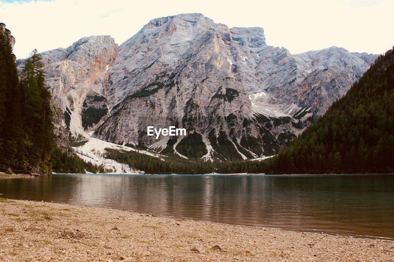 Scenic view of lake and mountains against sky