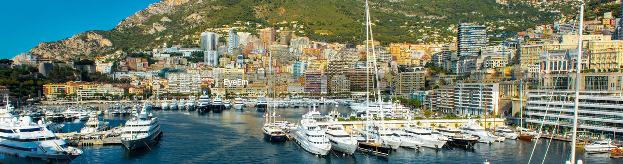 Boats moored at harbor