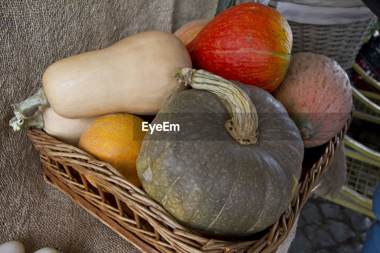 CLOSE-UP OF FRUITS IN WICKER BASKET