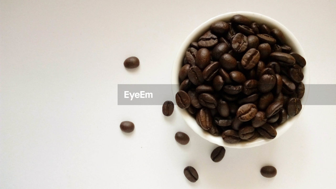 HIGH ANGLE VIEW OF COFFEE BEANS IN GLASS