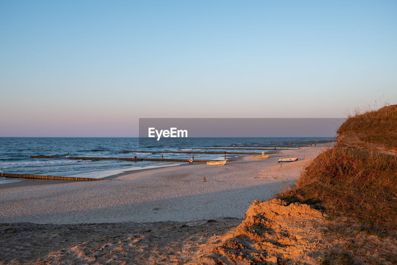 VIEW OF BEACH AGAINST CLEAR SKY