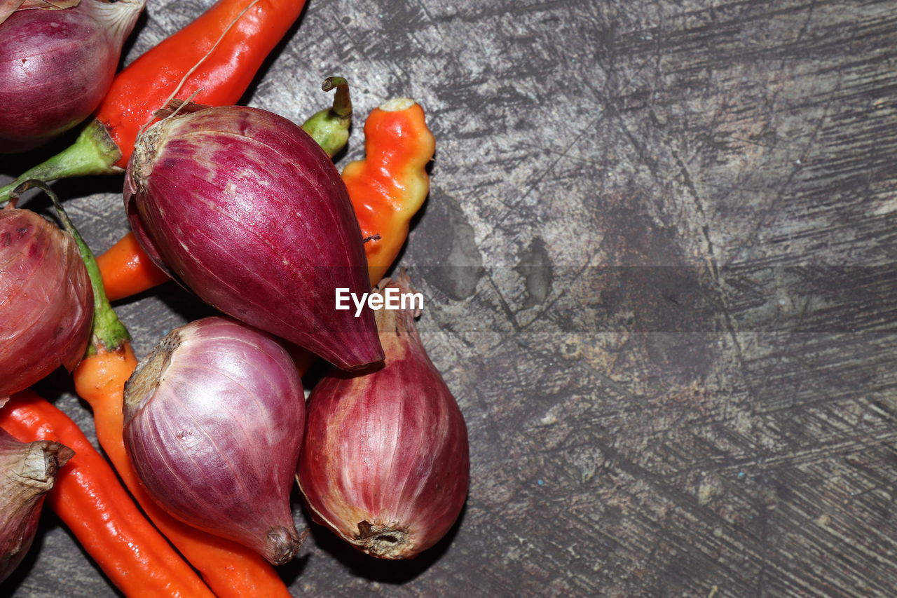 Chilies and onions on the table