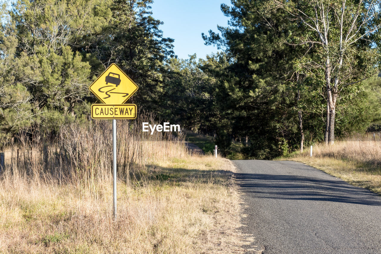 ROAD SIGN AGAINST SKY