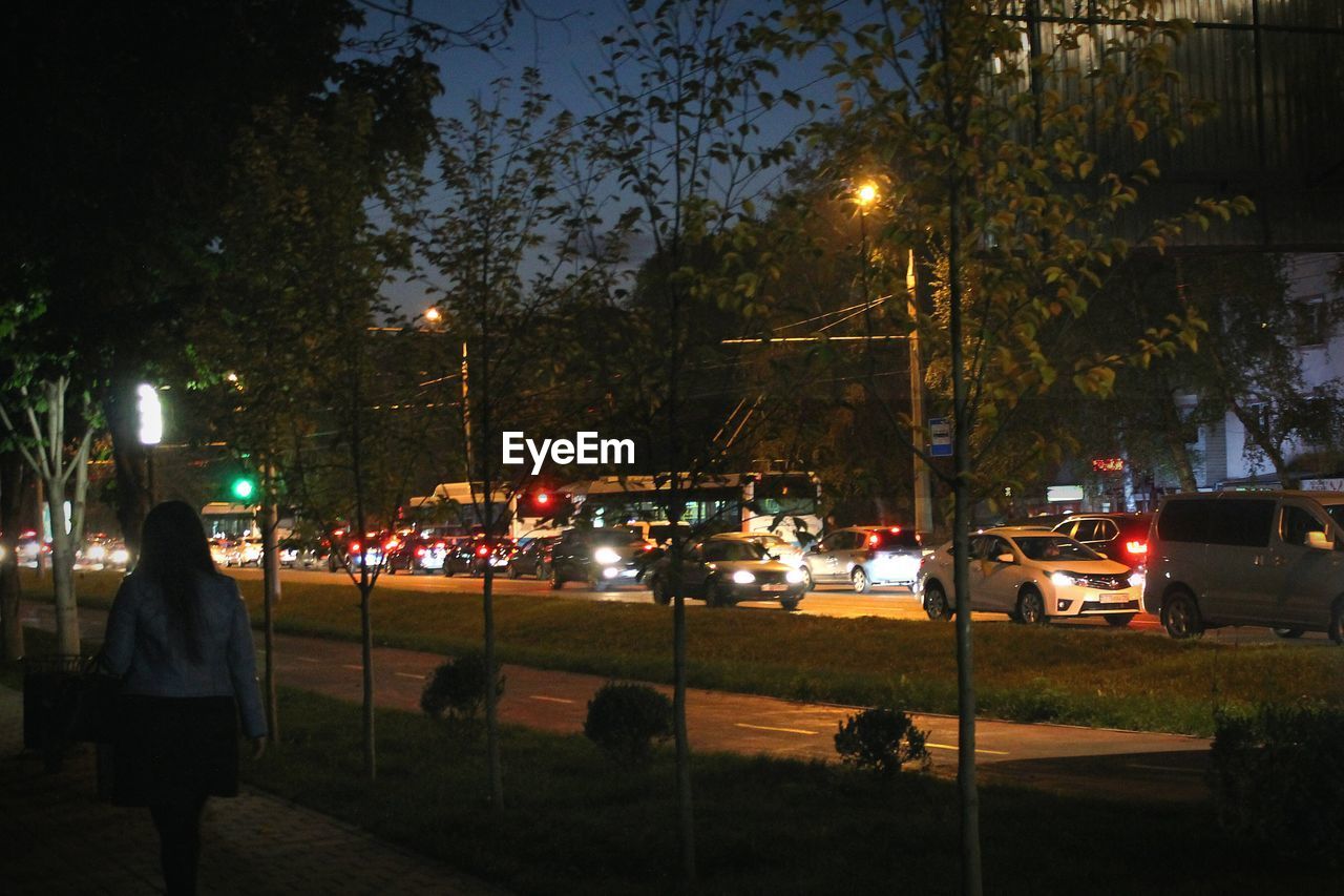 VEHICLES ON ROAD AT NIGHT