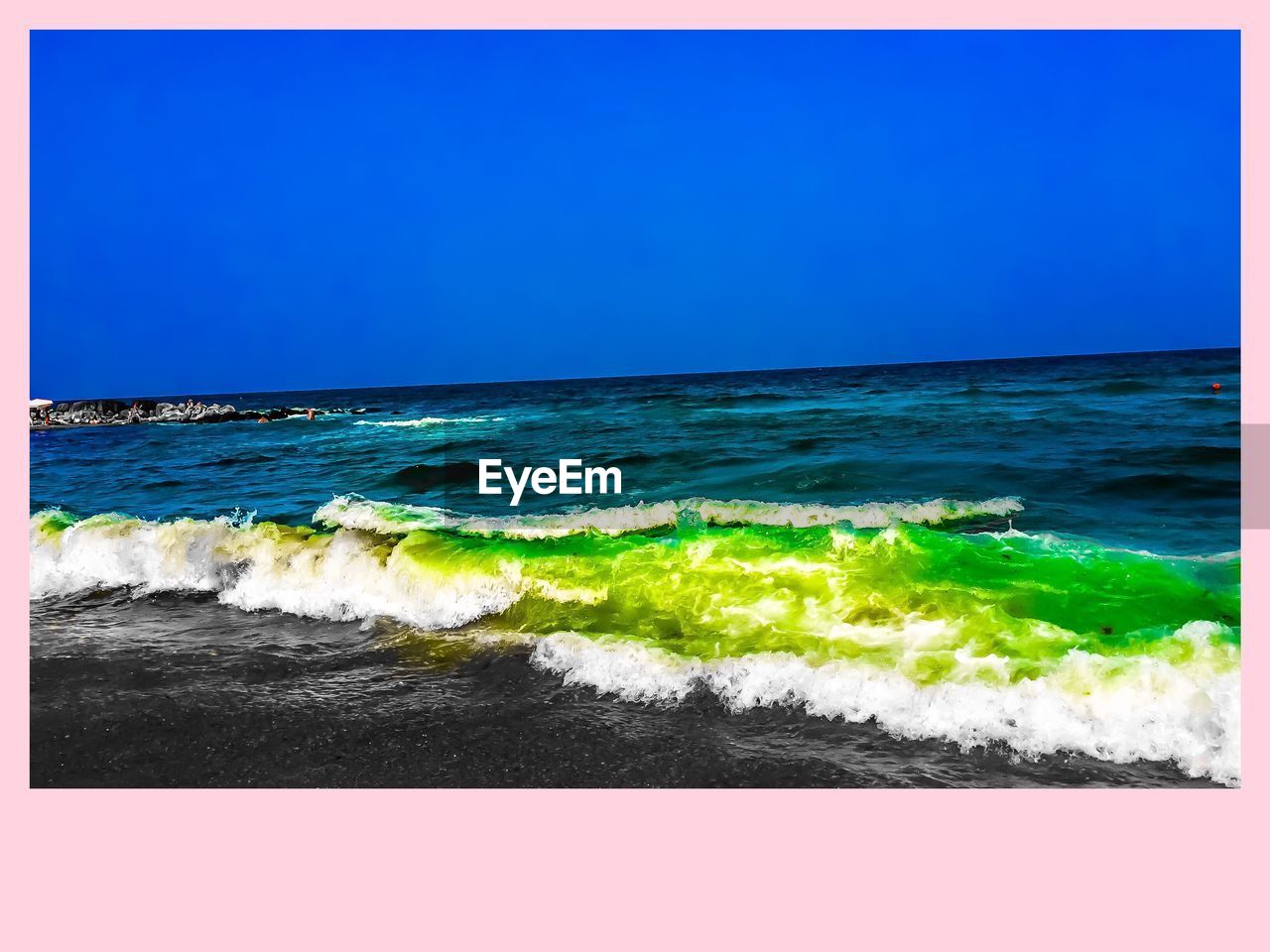 SCENIC VIEW OF BEACH AGAINST BLUE SKY