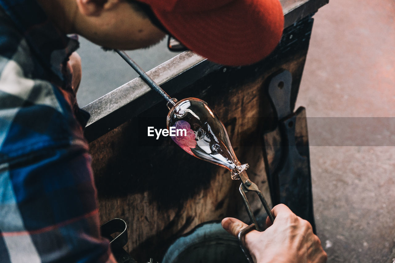 High angle view of man working at workshop