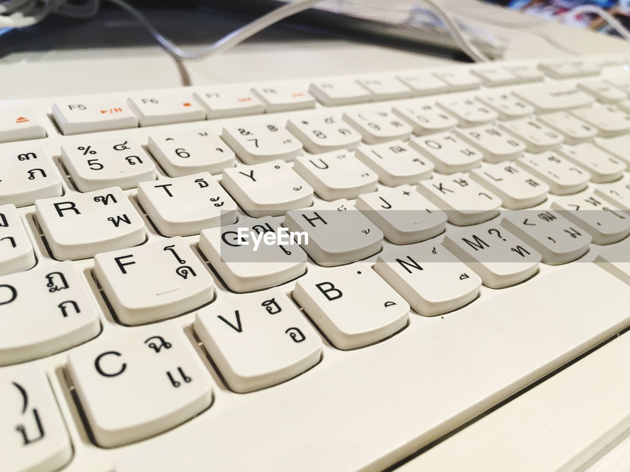 HIGH ANGLE VIEW OF COMPUTER KEYBOARD ON FLOOR