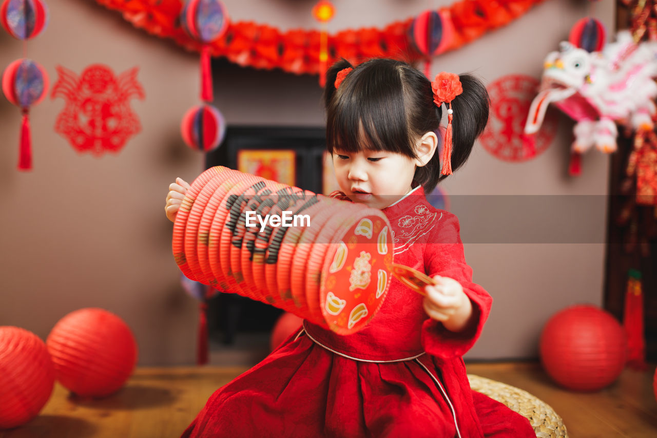 Cute girl standing in traditional clothing