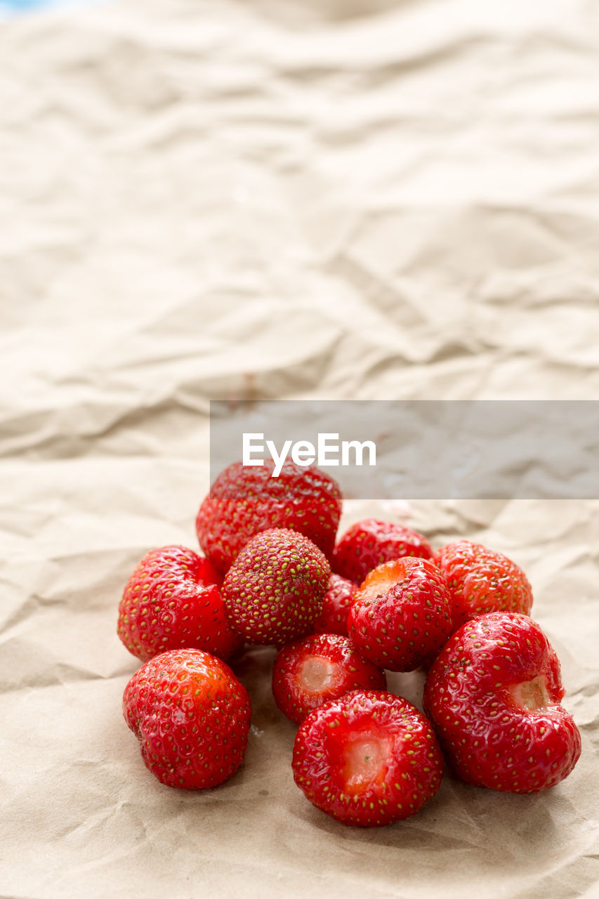 Close-up of strawberries on paper