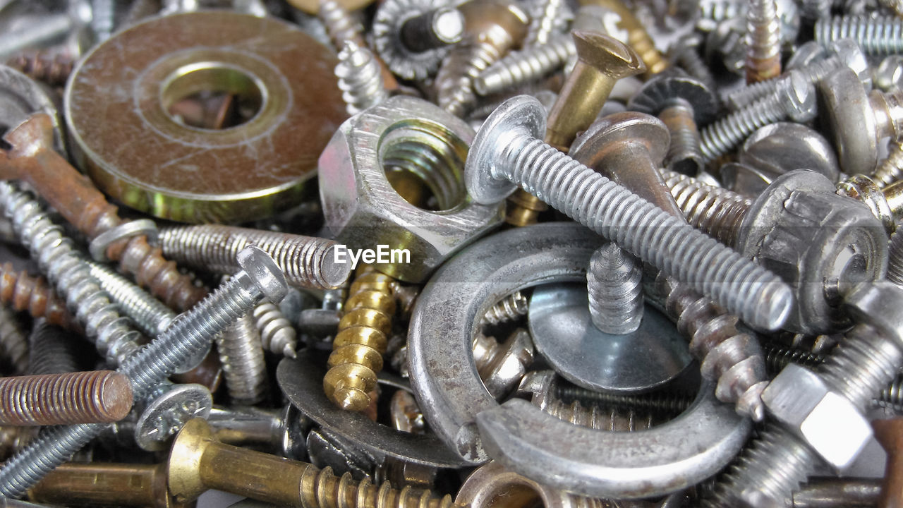 screw, metal, bolt, large group of objects, nut - fastener, close-up, backgrounds, abundance, no people, full frame, silver, work tool, heap, indoors, equipment, still life, industry, high angle view, mass production