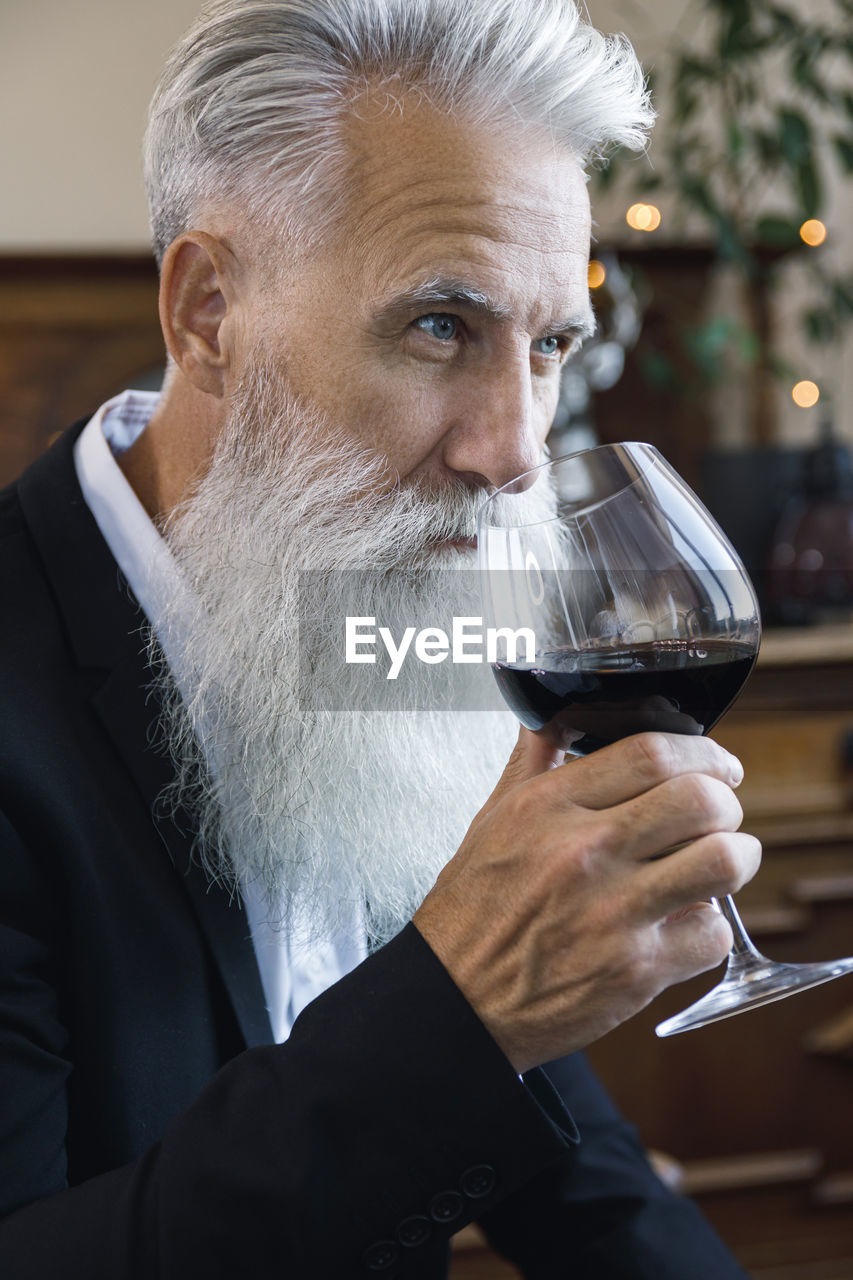 close-up of man drinking wine