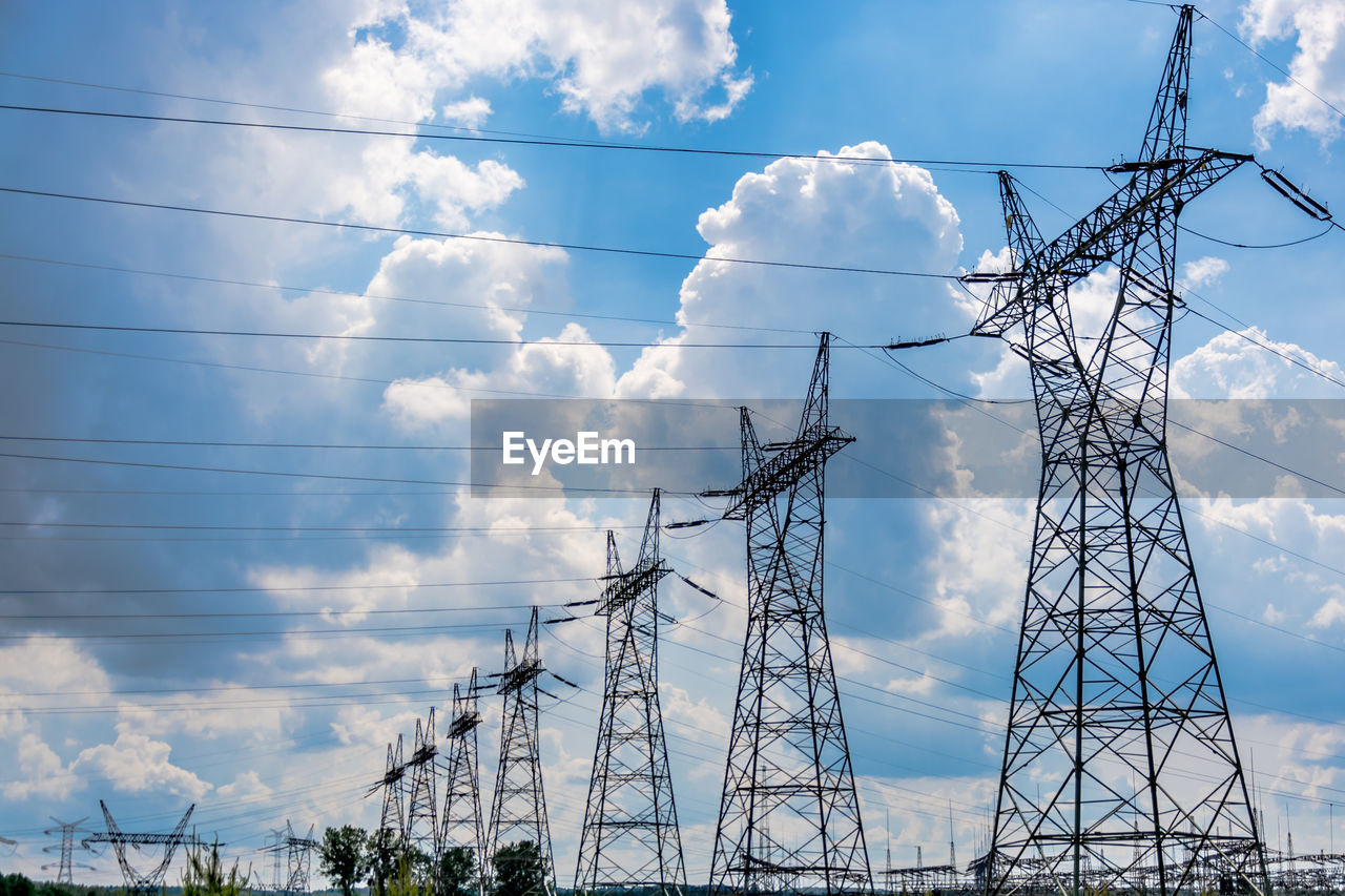 Low angle view of electricity pylon against sky