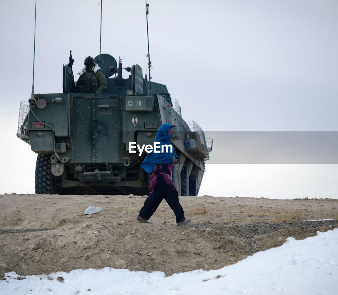 Woman walking on land during winter