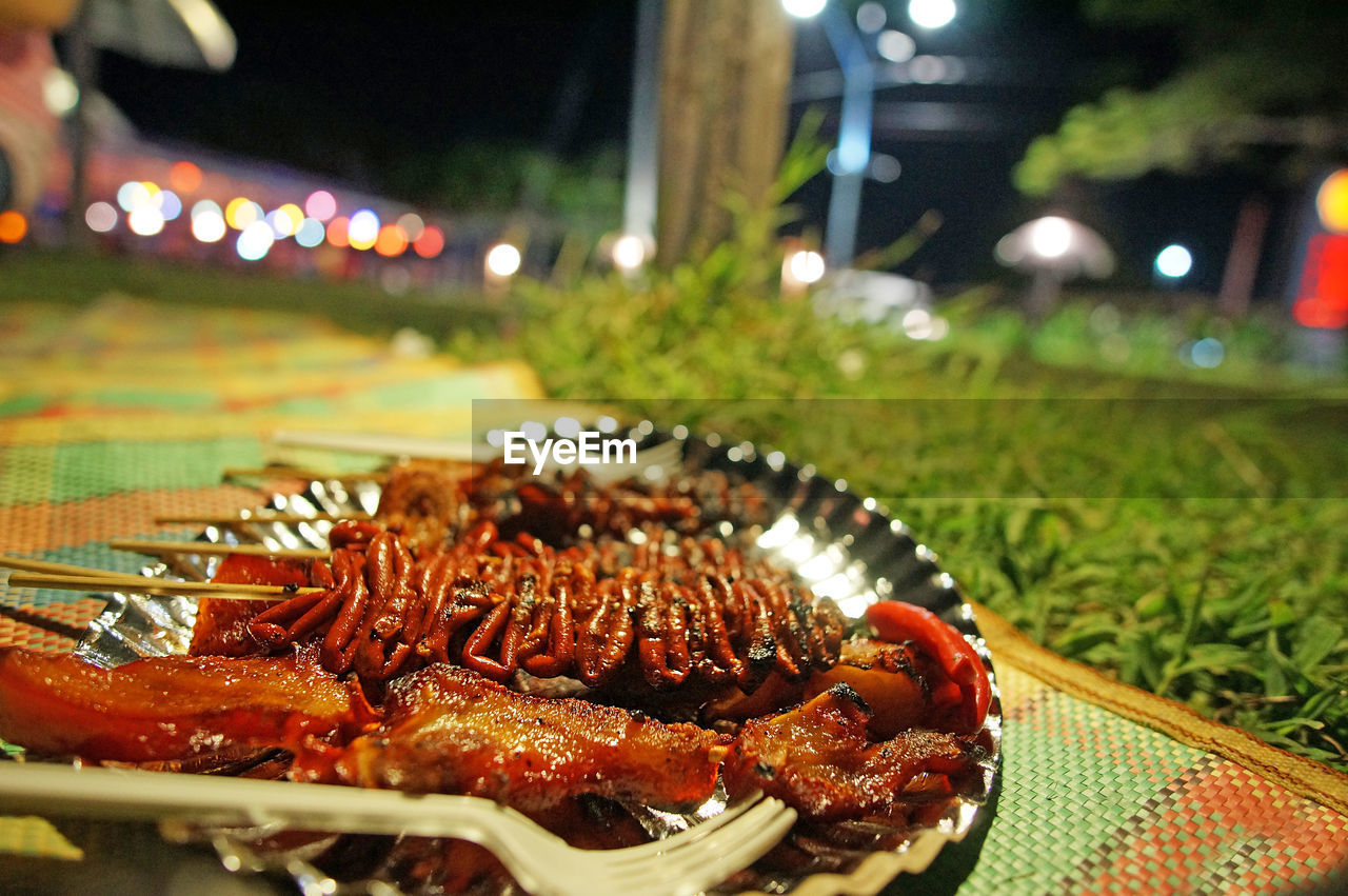 Close-up of food in plate on table at night