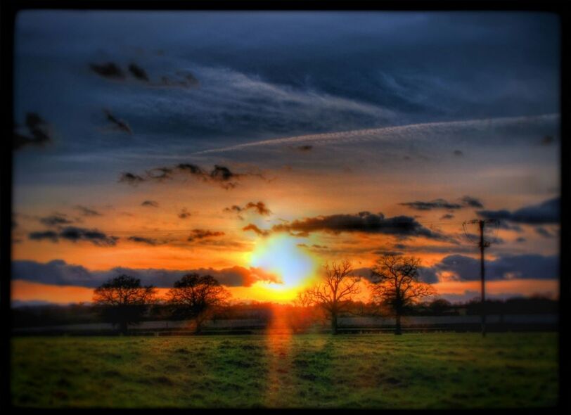 SCENIC VIEW OF SUNSET OVER LANDSCAPE