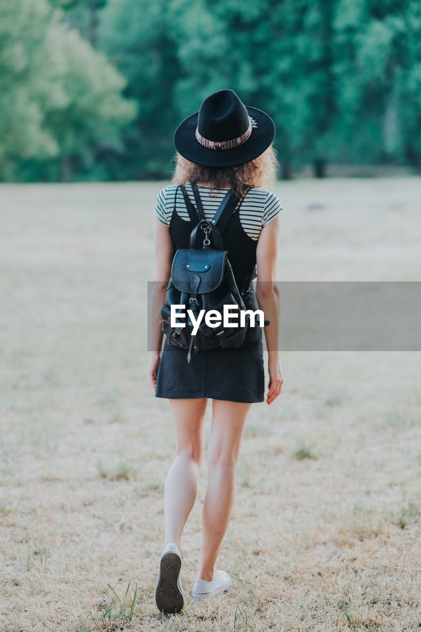 Rear view of woman walking outdoors