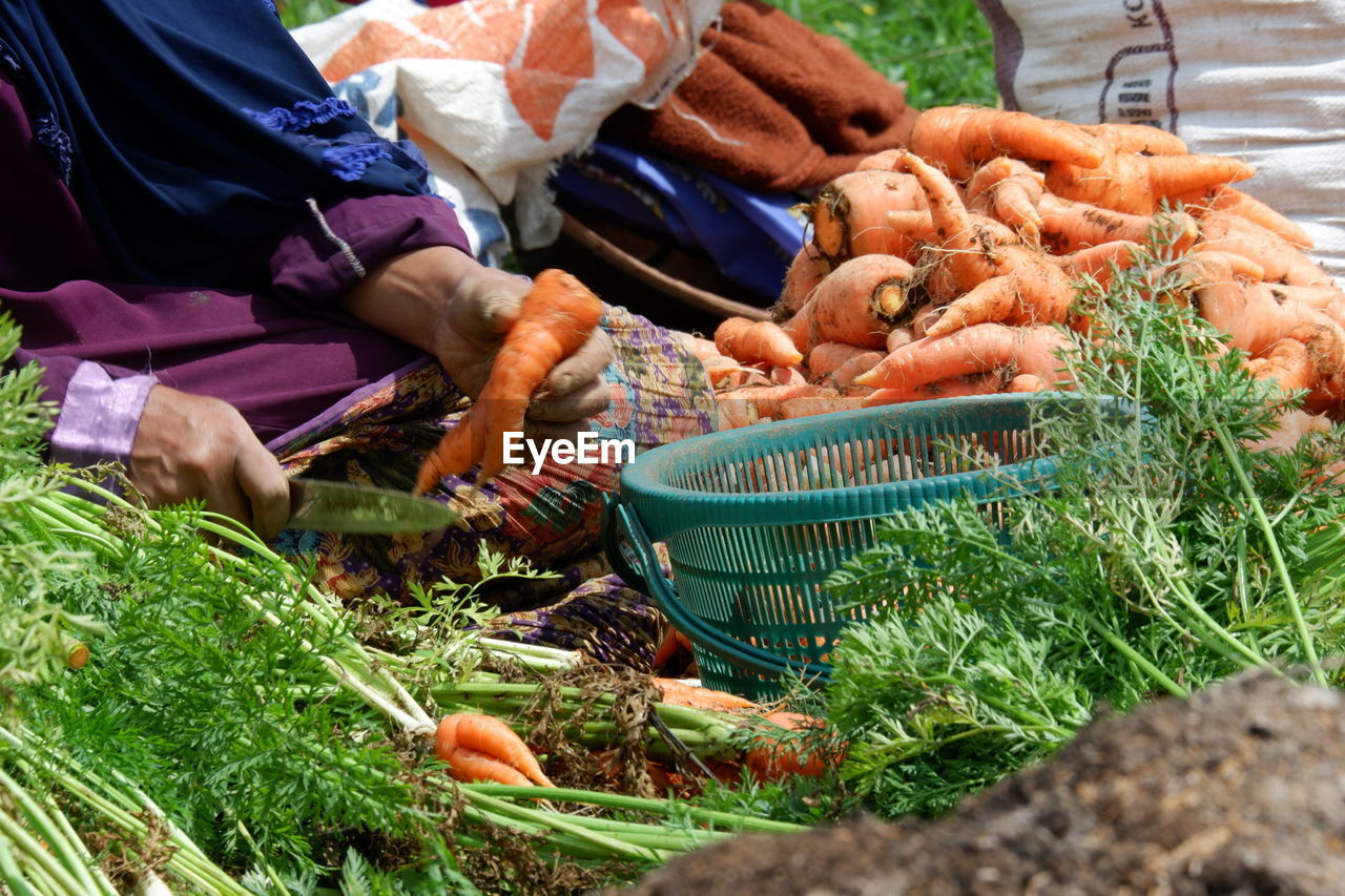 MAN WORKING IN BASKET
