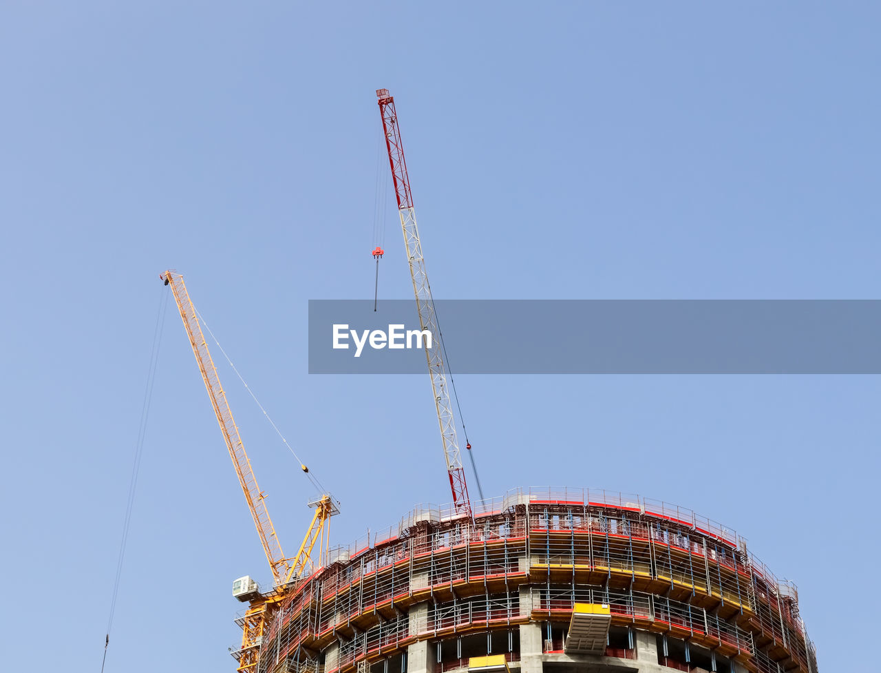 Big cranes at construction sites in the city of dubai in the united arab emirates