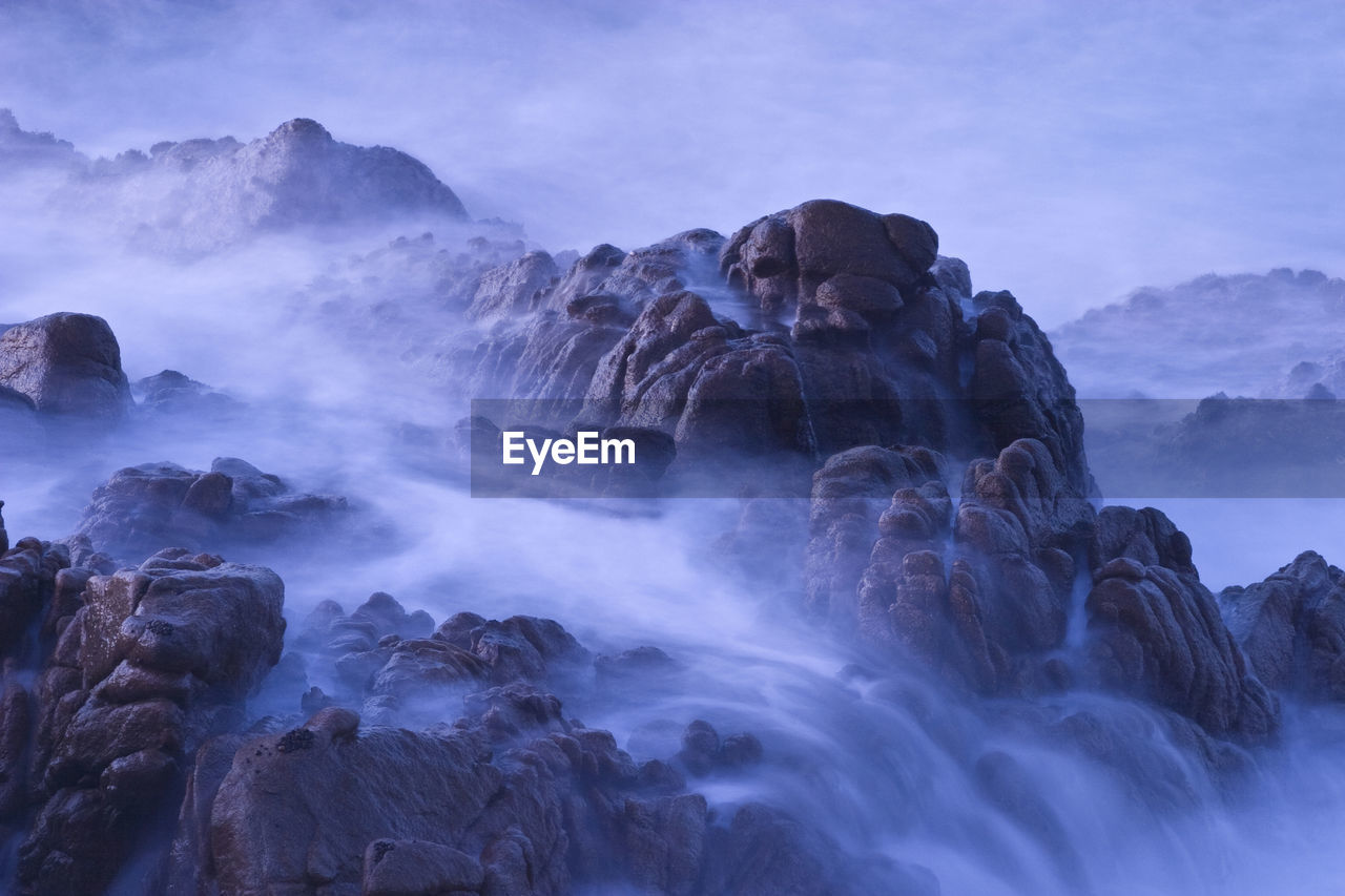 Waves break over rocks in  puerto vallarta