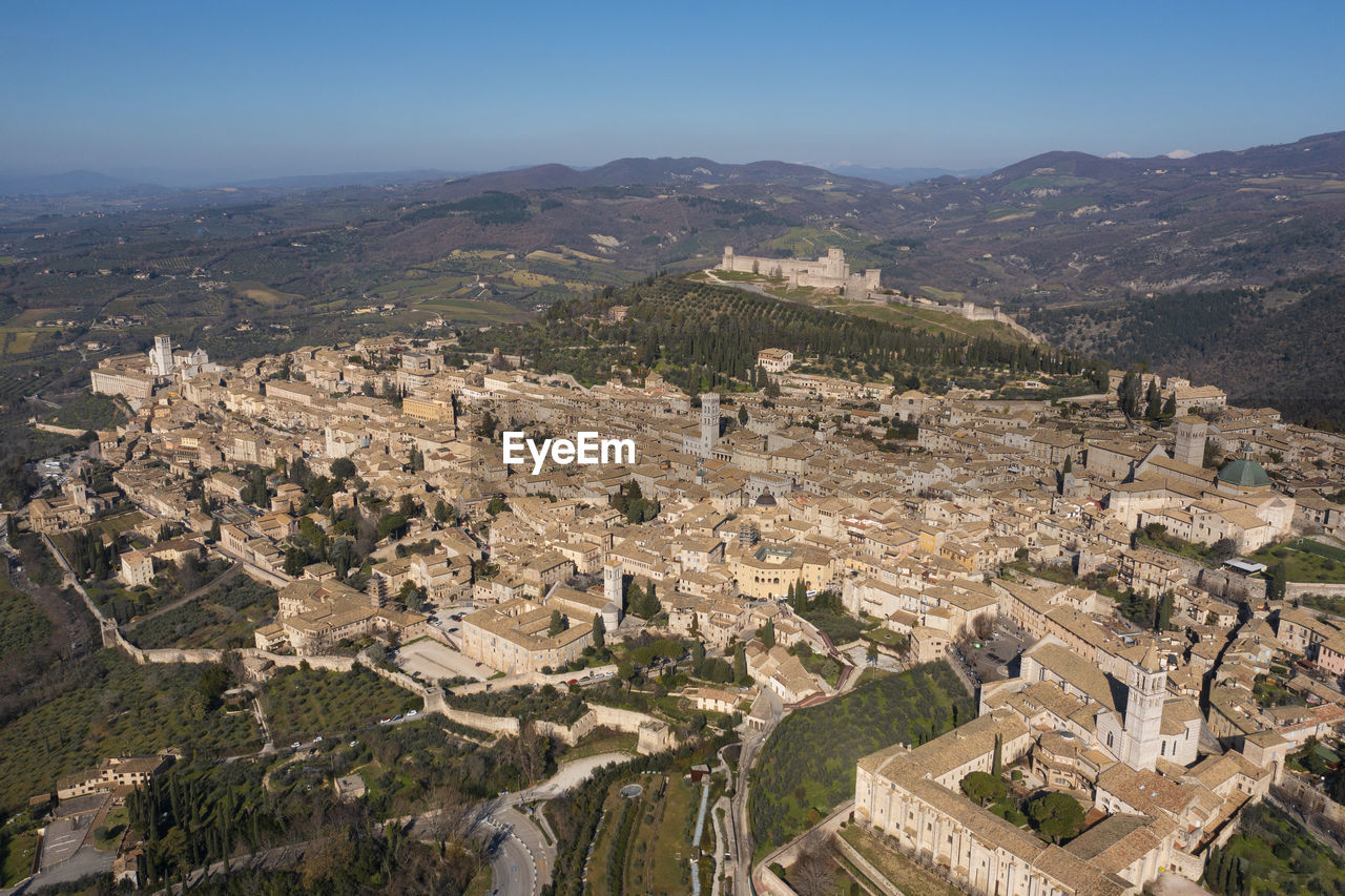 Extended frontal aerial view of the city of assisi umbria