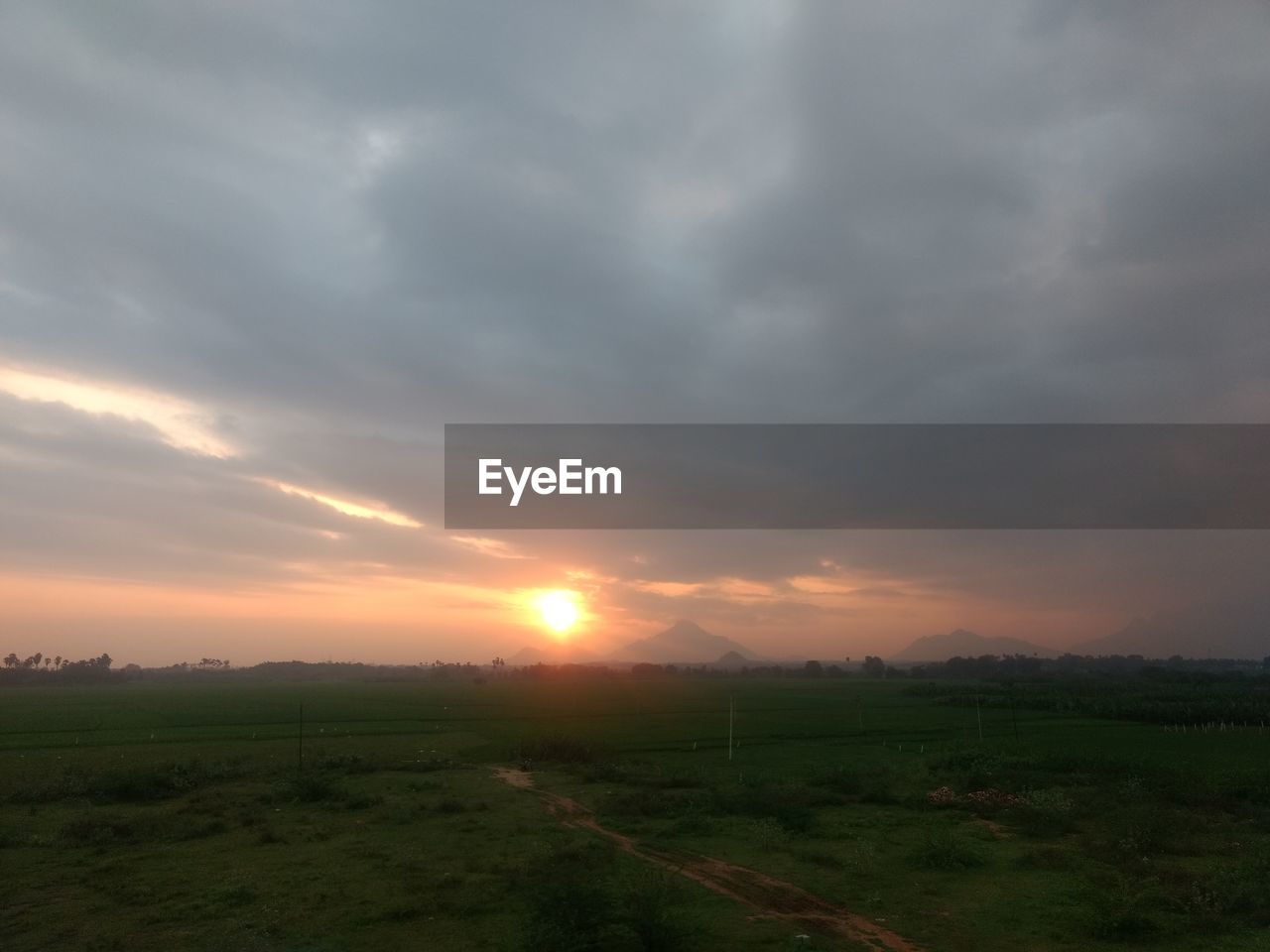 SCENIC VIEW OF SUNSET OVER LANDSCAPE