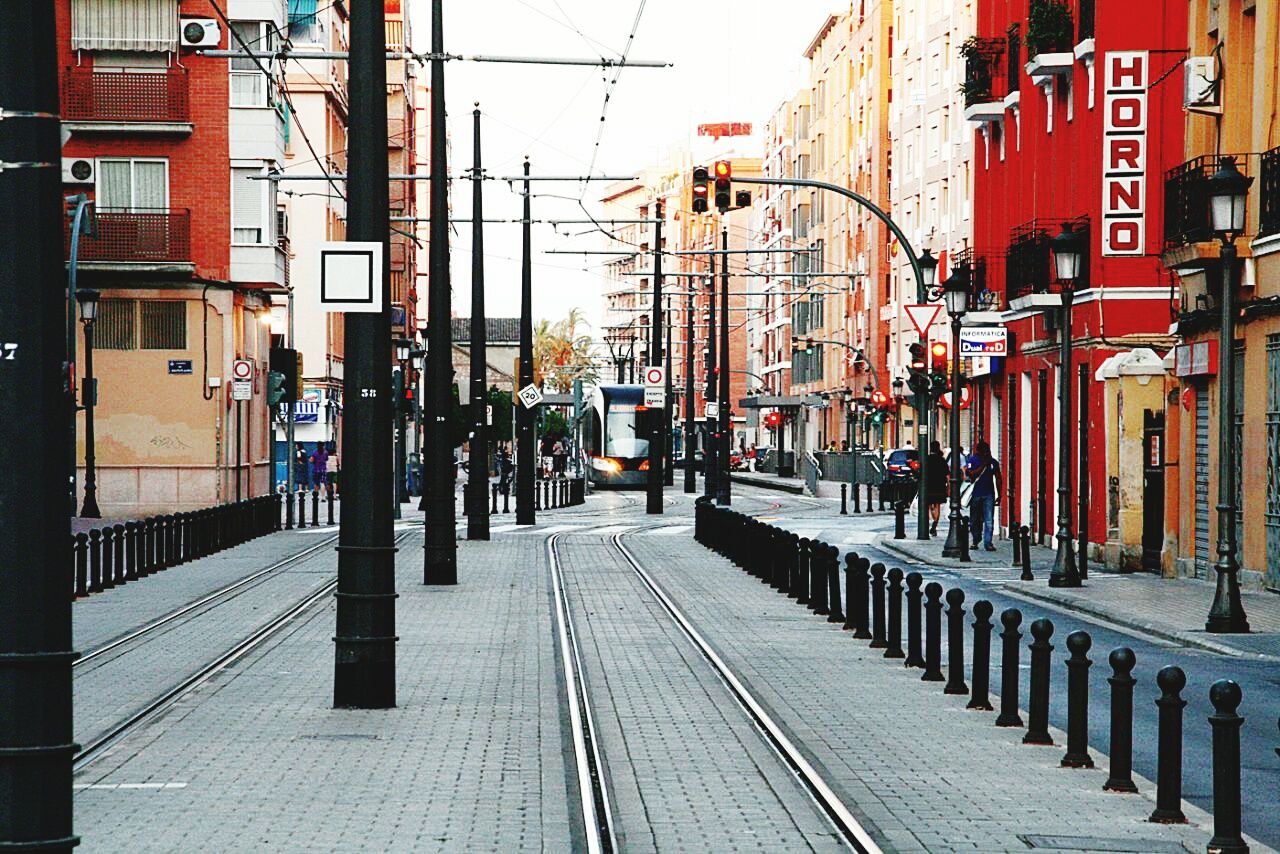 RAILROAD TRACKS ON CITY STREET