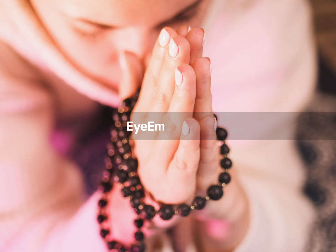 Close-up of woman praying