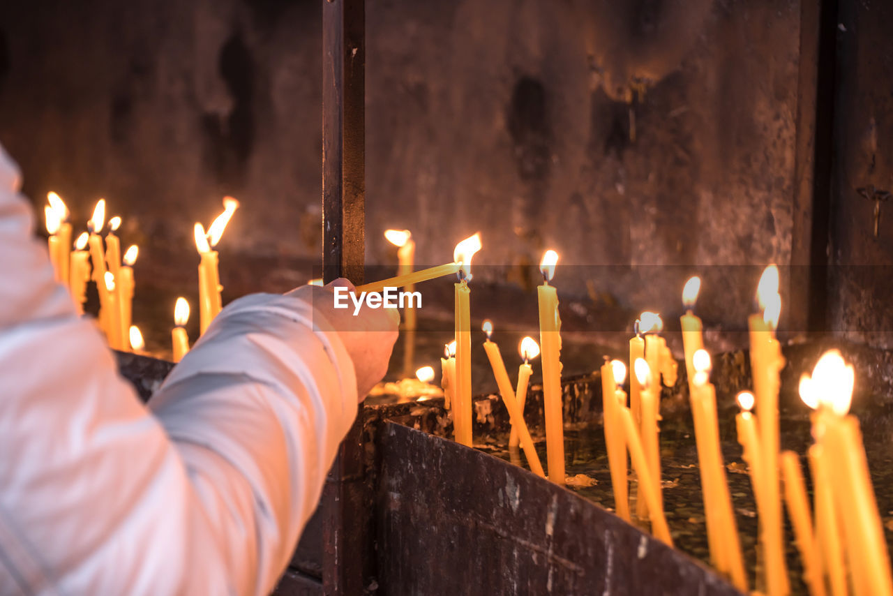 BURNING CANDLES IN TEMPLE