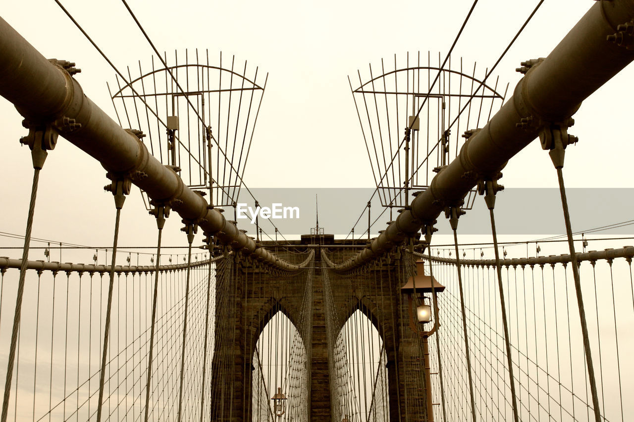 BRIDGE AGAINST SKY AT SUNSET