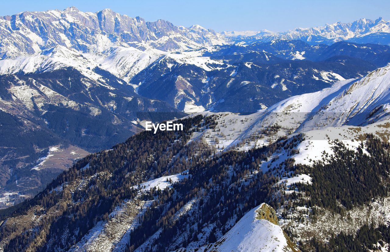 Aerial view of sunny mountain range in alps of winter austria