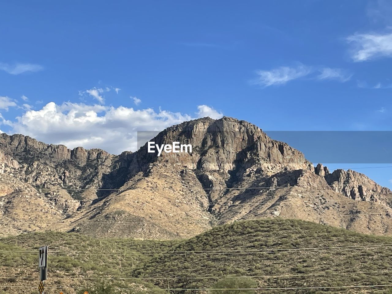 mountain, sky, landscape, environment, scenics - nature, nature, mountain range, beauty in nature, cloud, land, travel destinations, wilderness, rock, travel, valley, plant, no people, blue, non-urban scene, tranquil scene, plateau, tranquility, outdoors, ridge, day, tourism, mountain peak, tree, activity, idyllic, rock formation, mountain pass, grass, geology, rural scene, leisure activity