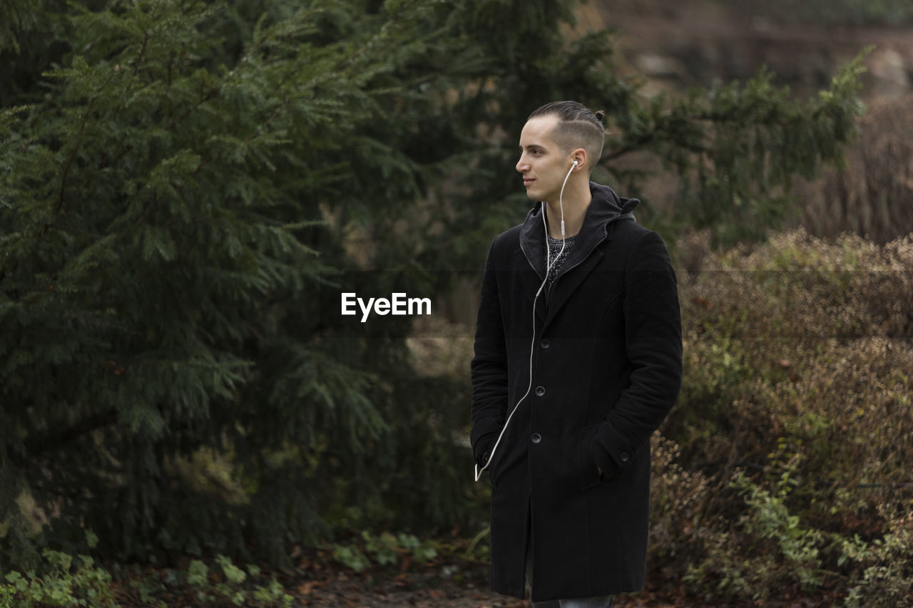 Woman looking away in forest