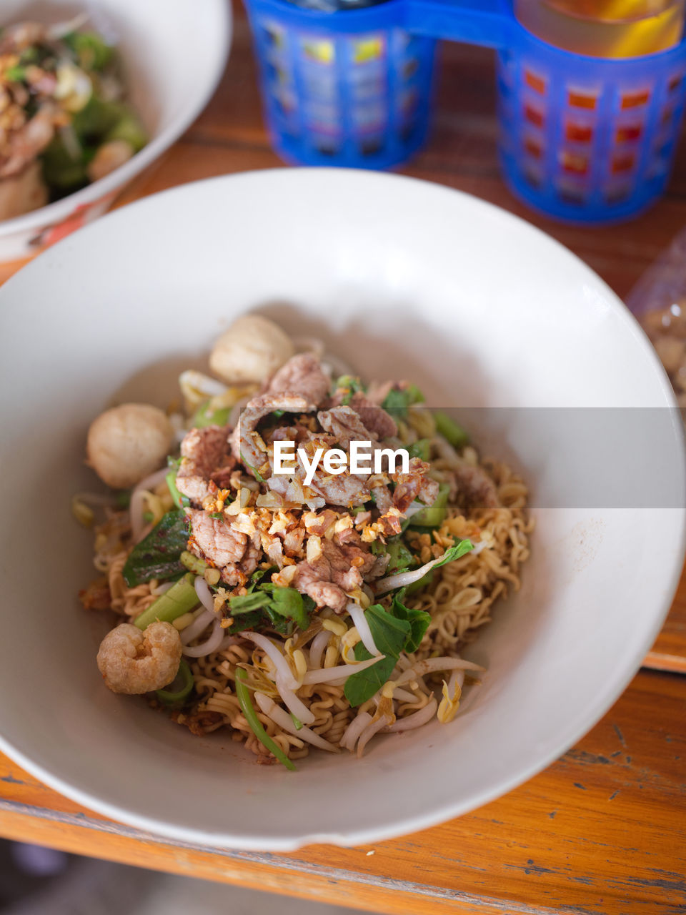 Thai noodle beef is very delicious on wood table