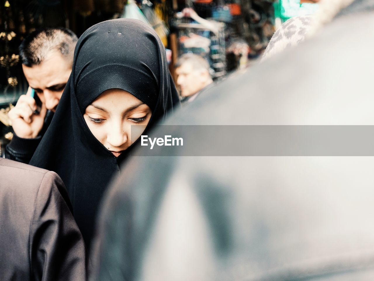 Young woman wearing hijab in city