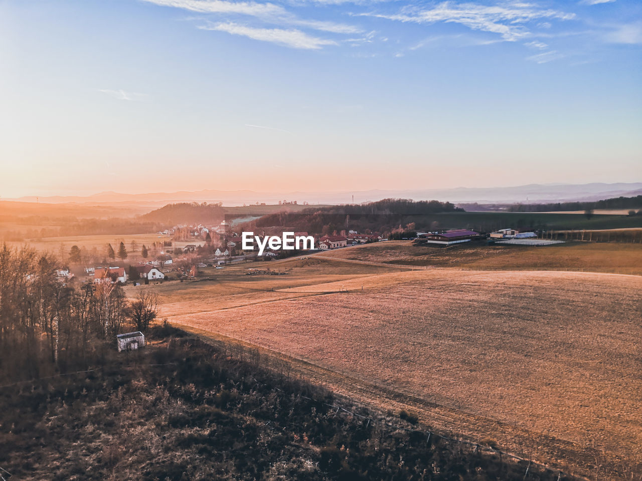 Scenic view of landscape against sky during sunset