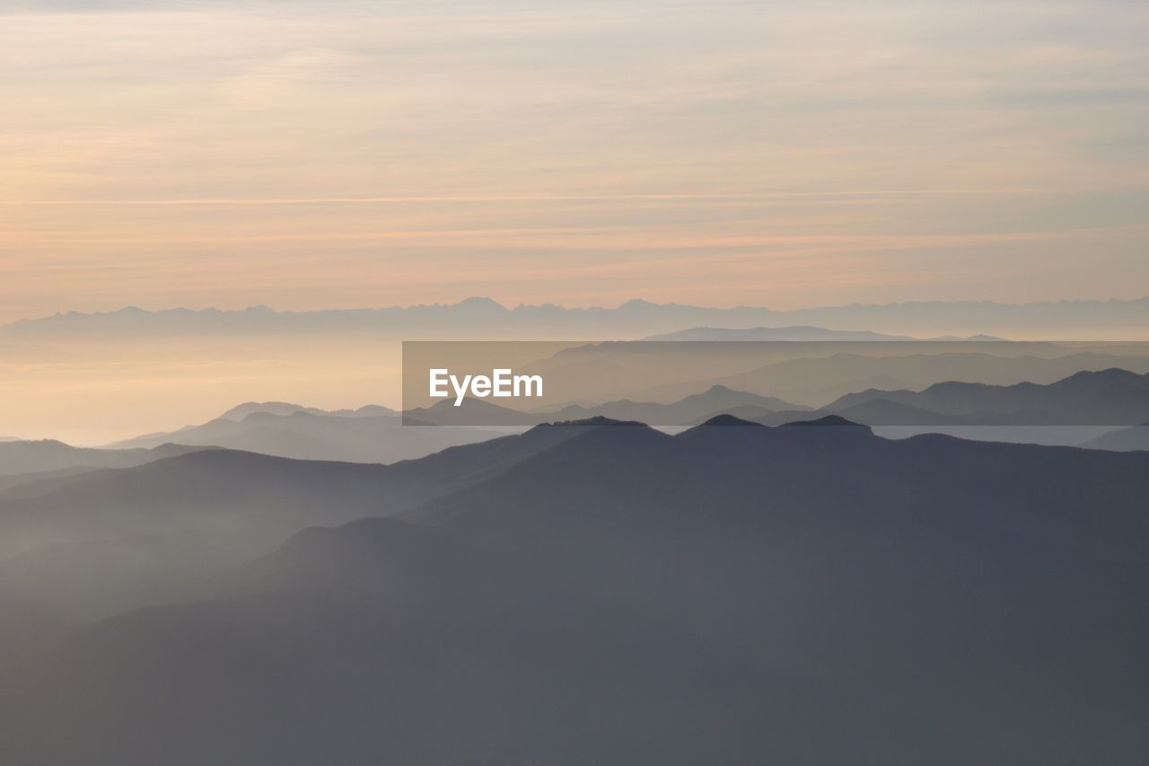 Scenic view of mountains against sky during sunset