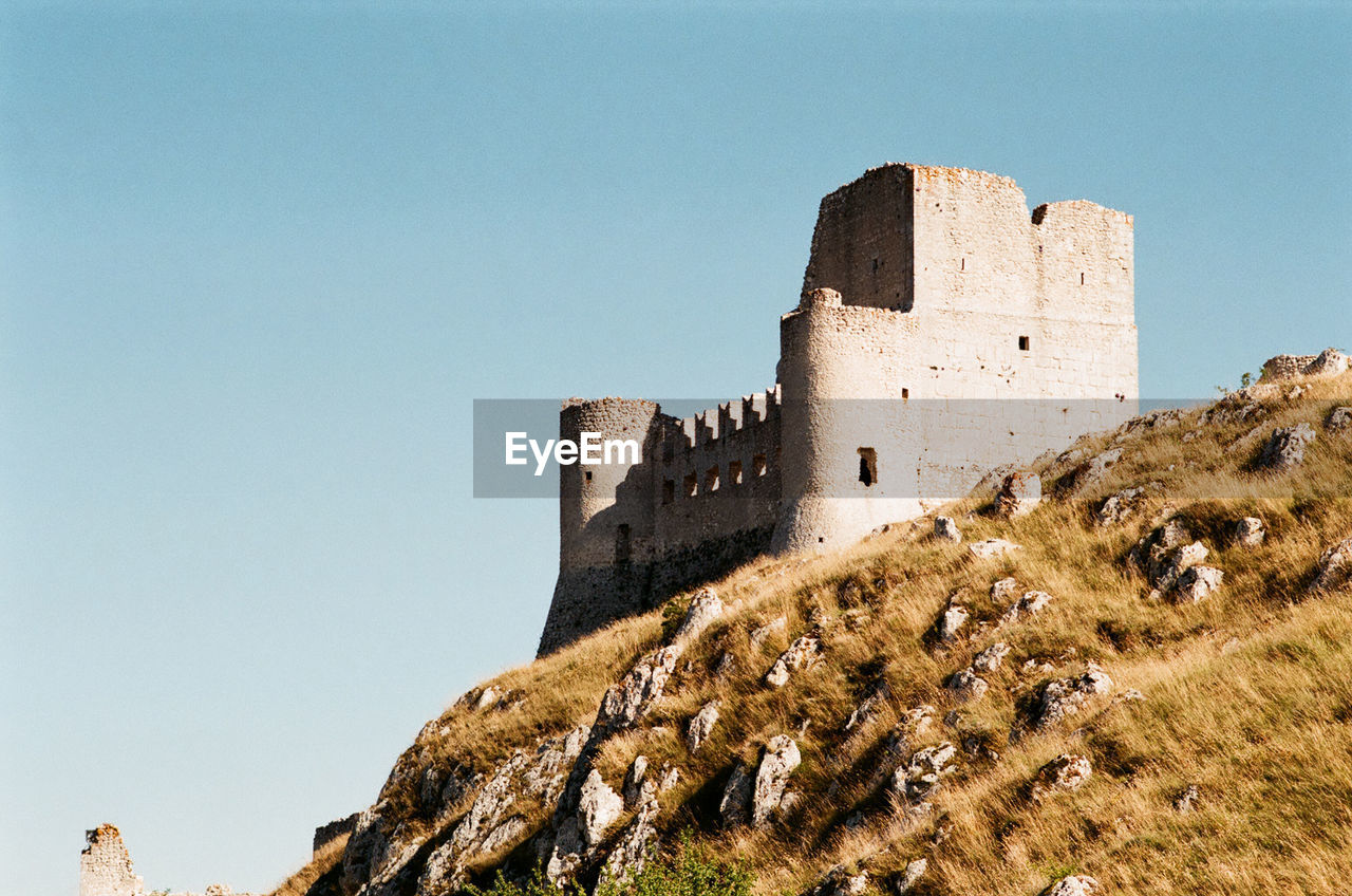 Low angle view of fort against clear sky