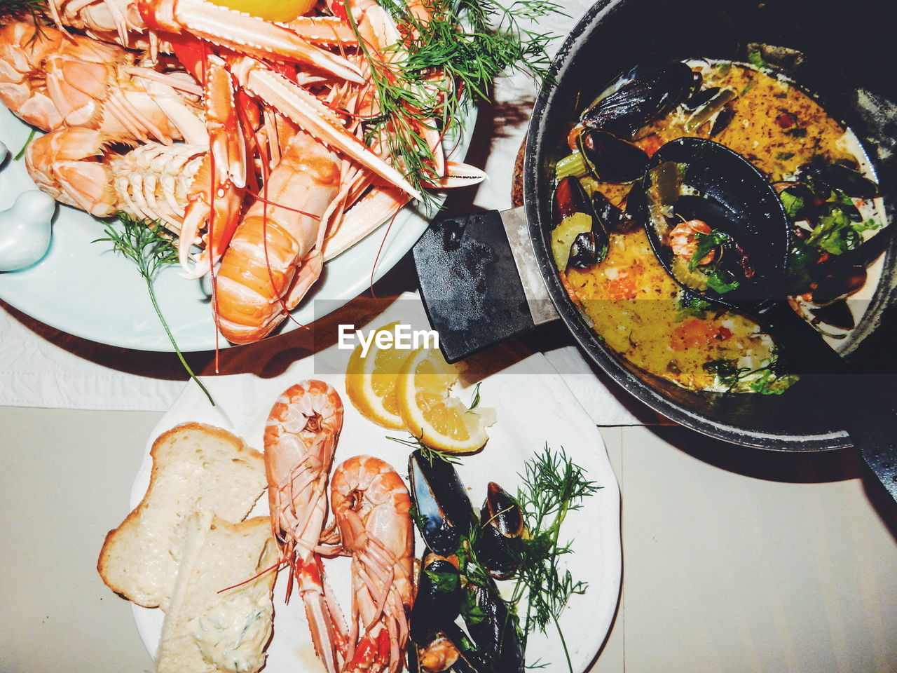 Directly above shot of seafood served in plates on table