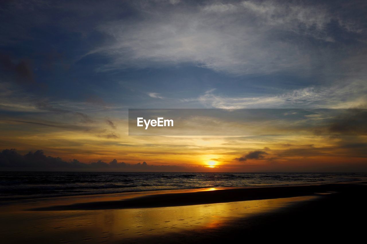 Scenic view of sea at sunset