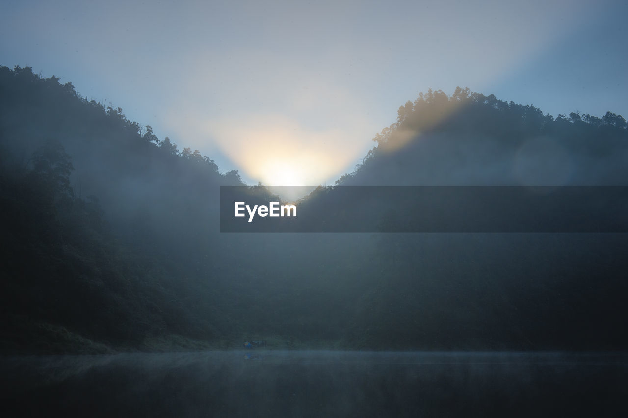 Scenic view of mountains against sky during sunset