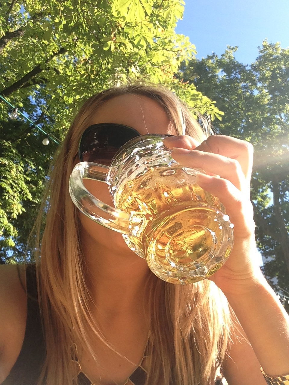 Young woman drinking beer