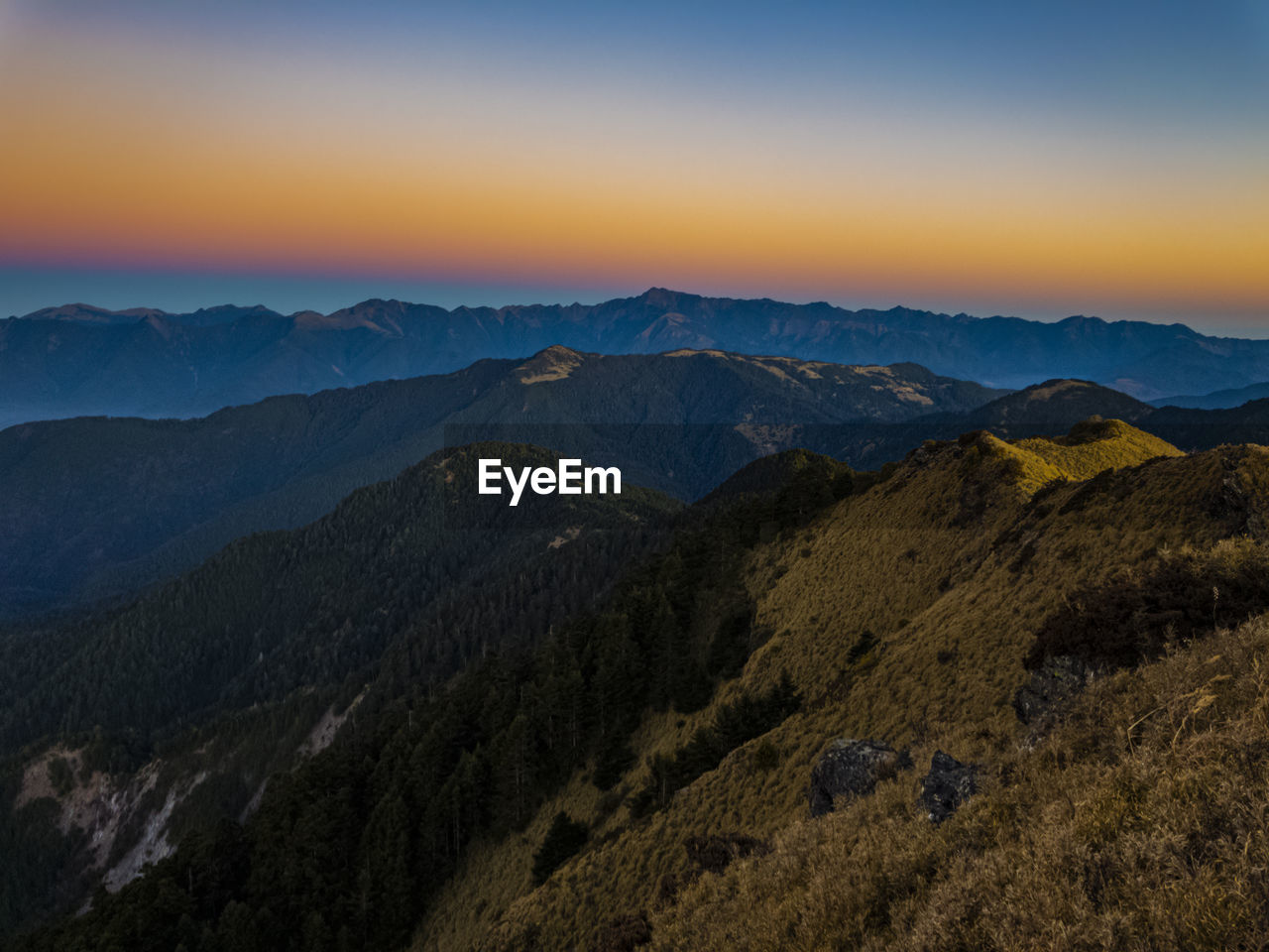 Scenic view of mountains against sky during sunset