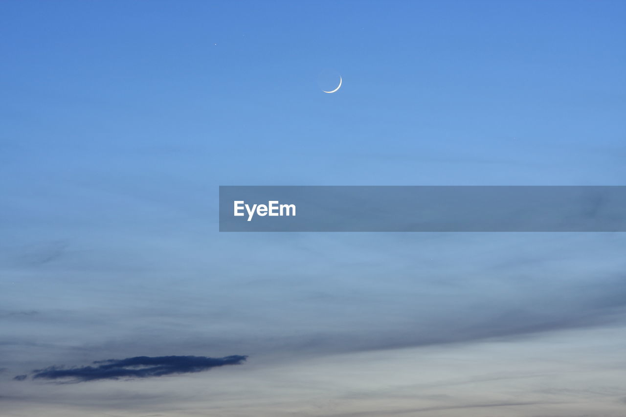 LOW ANGLE VIEW OF MOON AGAINST SKY AT NIGHT
