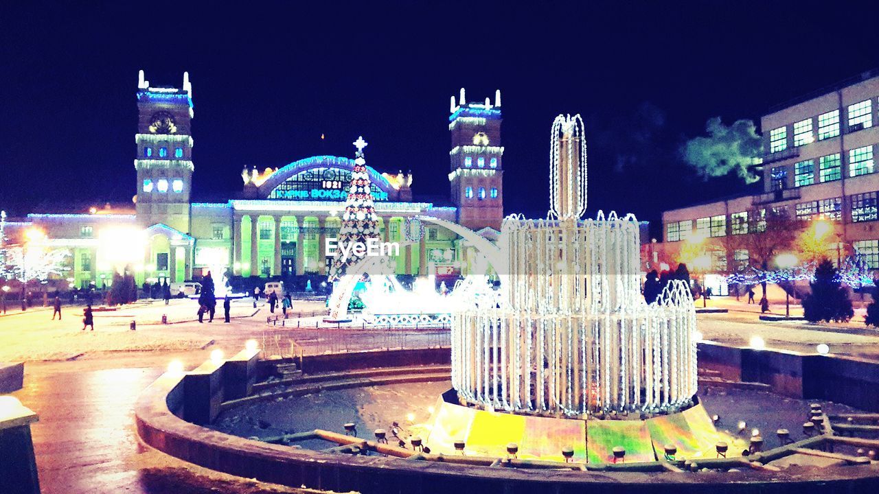 ILLUMINATED FOUNTAIN AT NIGHT