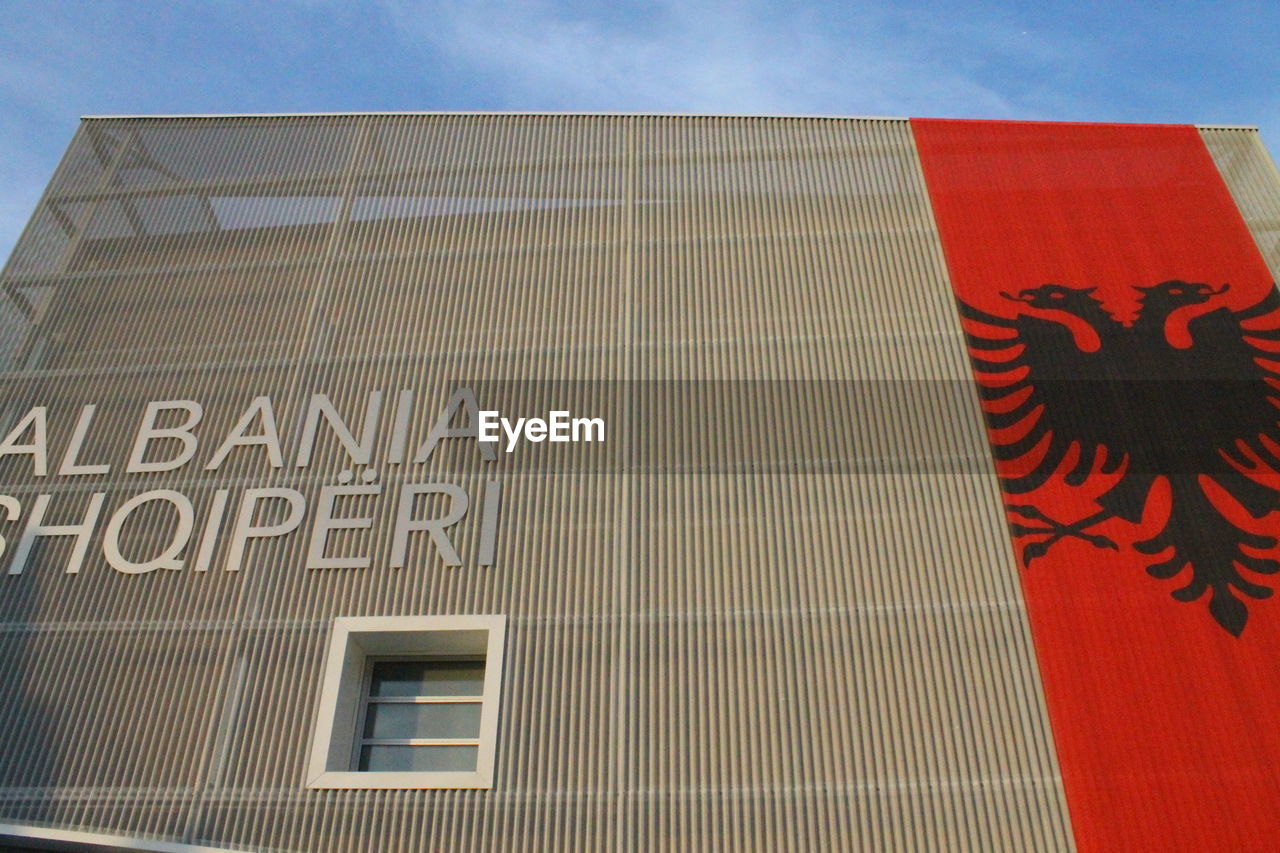 CLOSE-UP OF FLAG AGAINST SKY