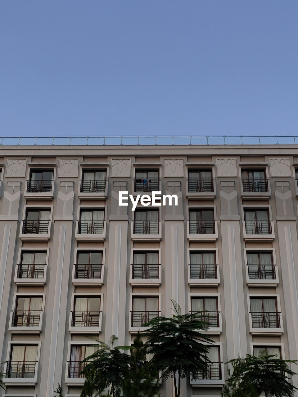 Low angle view of building against clear blue sky