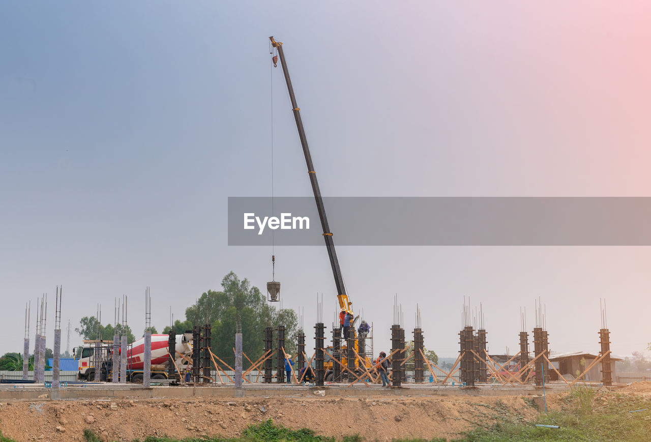 Construction site background. hoisting cranes and concrete truck new.building construction site
